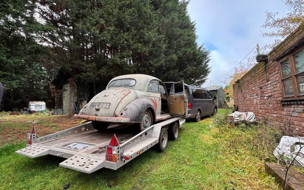 Vintage car on a trailer ready for restoration at Luke Martin Coachworks.